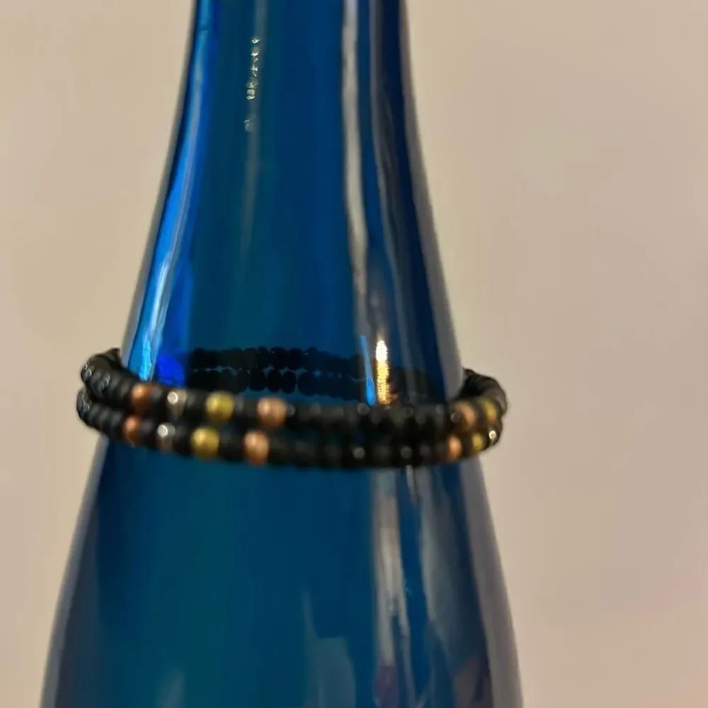 Black beaded bracelet with metallic beads